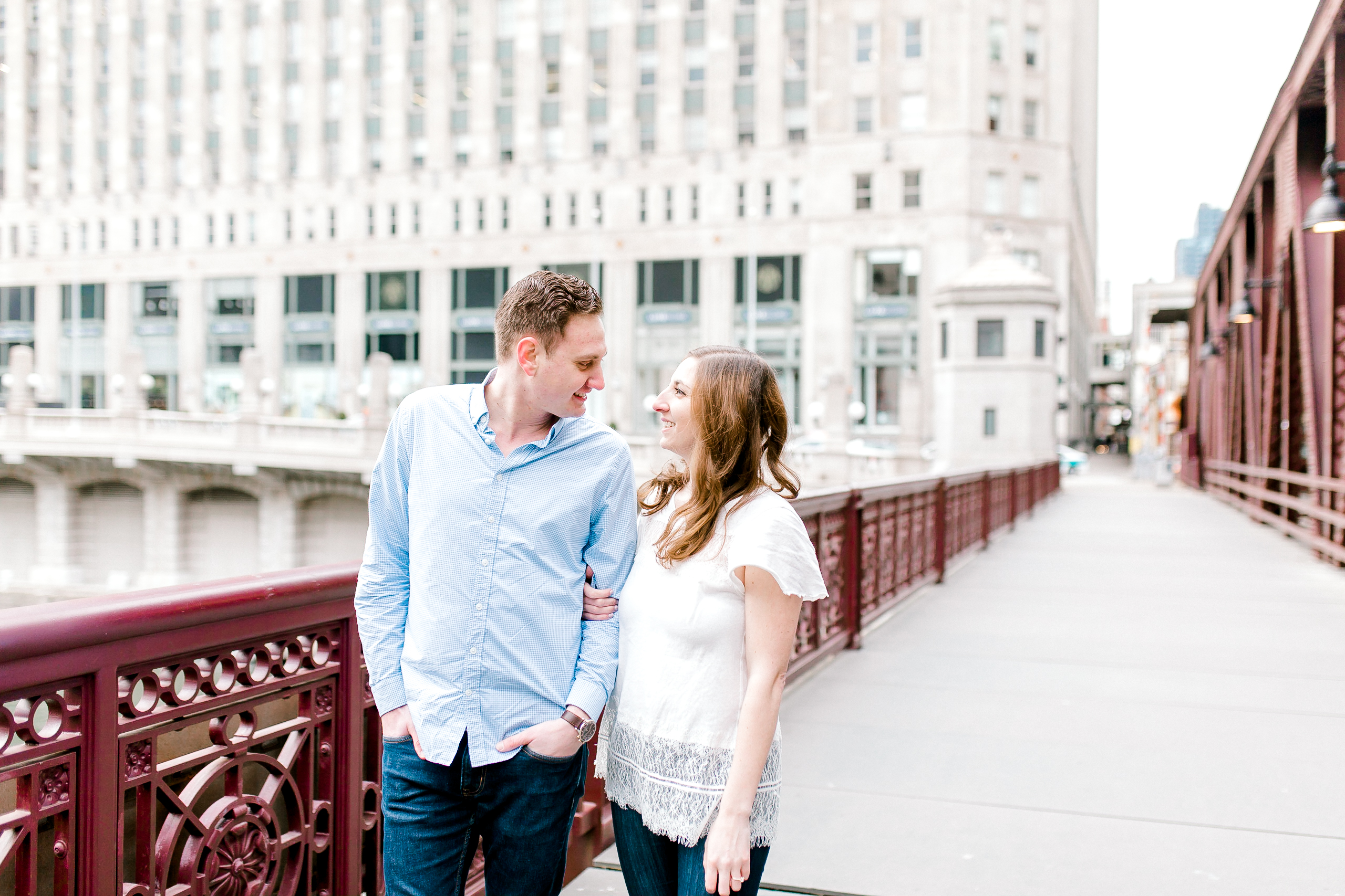 walking among the Riverwalk in Chicago engagement session