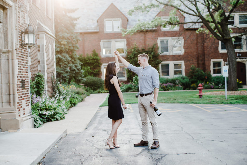 couple dancing in front of mayslake peabody estate during engagement session
