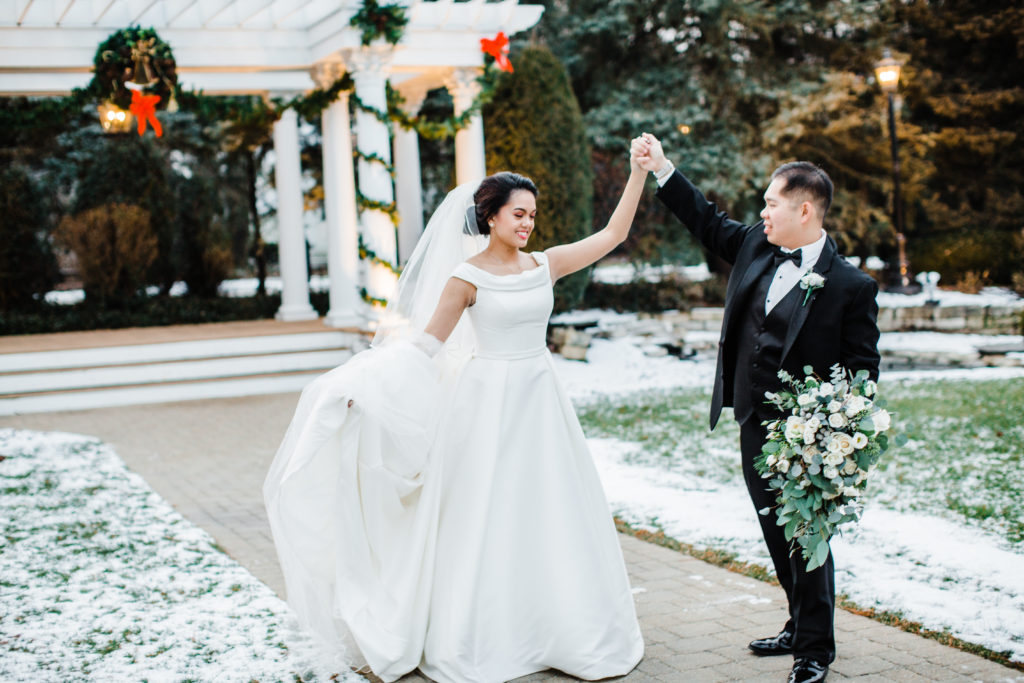 bride and groom dancing in front of gazebo at Haley Mansion
