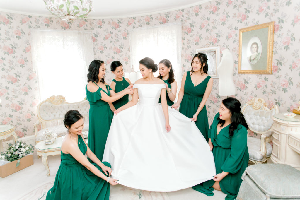 bride with bridesmaids in getting ready room at Haley Mansion by chicago wedding photographer