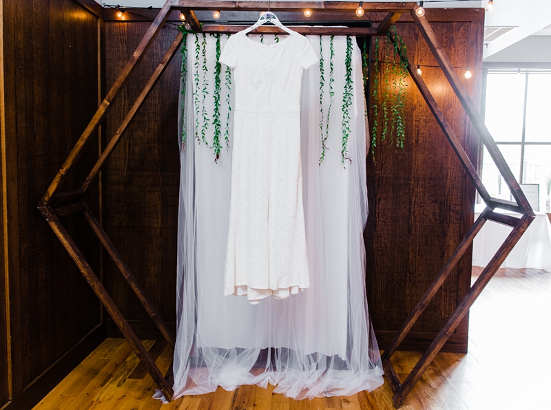 wedding dress hanging on the alter
