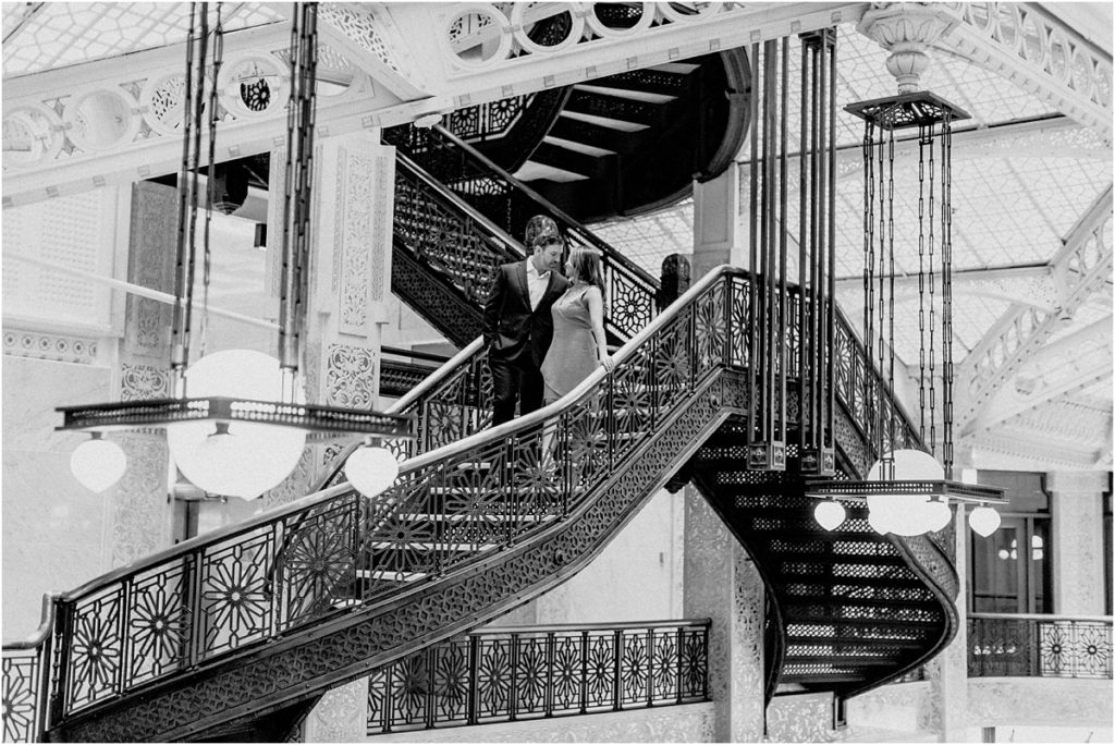 Rookery Building Engagement Session on the staircase black and white engagement session posing, great locations for engagement photos