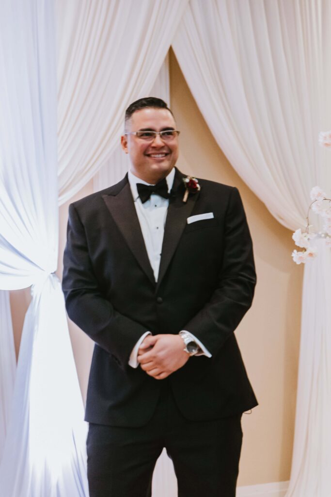 groom seeing the bride for the first time walking down the aisle