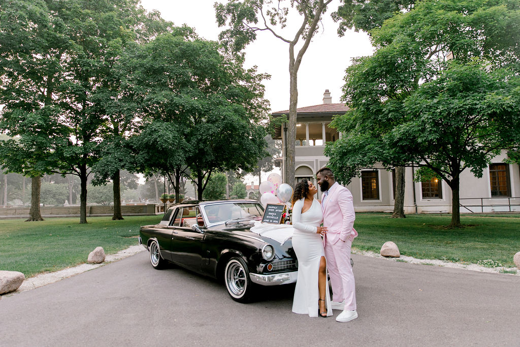 Against the vintage car, the couple's laughter and connection become the focal point of their Armour House engagement session.