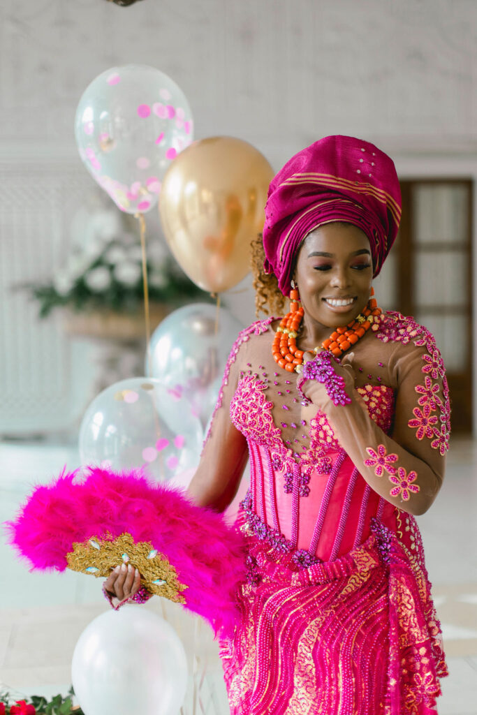 Nigerian custom-designed fuchsia outfit for woman