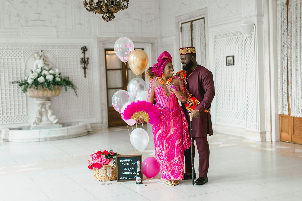 In their Nigerian-inspired fuchsia attire, the couple's engagement session at Armour House becomes a celebration of diversity, love, and the beauty of merging cultures at Armour House in Lake Forest Academy 
