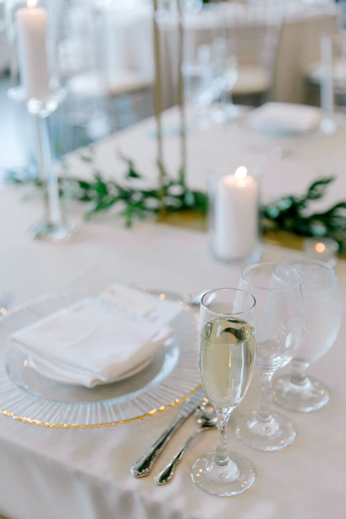 elegant white green and candles wedding reception decor
