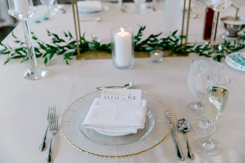 elegant and classy white green and candles wedding reception decor