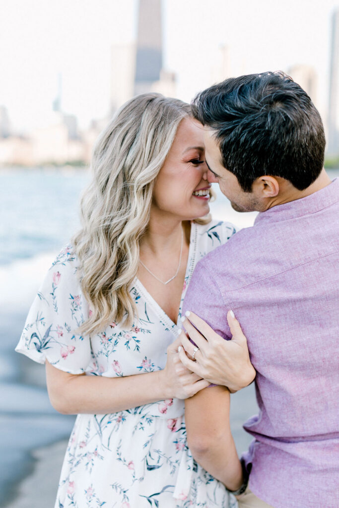 City Lights and Love: Sunset hues painting the skyline as the couple shares tender moments, skillfully photographed by a Chicago wedding photographer.