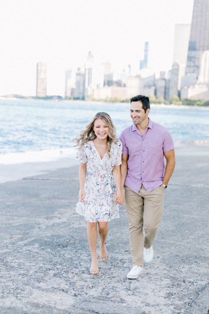 Playful Promenades: Sara and Anthony strolling hand in hand along the pathways of Lincoln Park and North Ave, radiating joy.