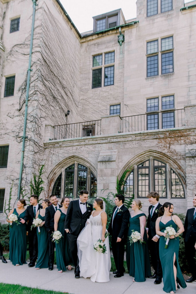 Dominical University bridal party portrait. Emerald green and gold,