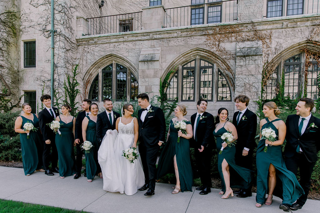 Dominical University bridal party portrait. Emerald green and gold,