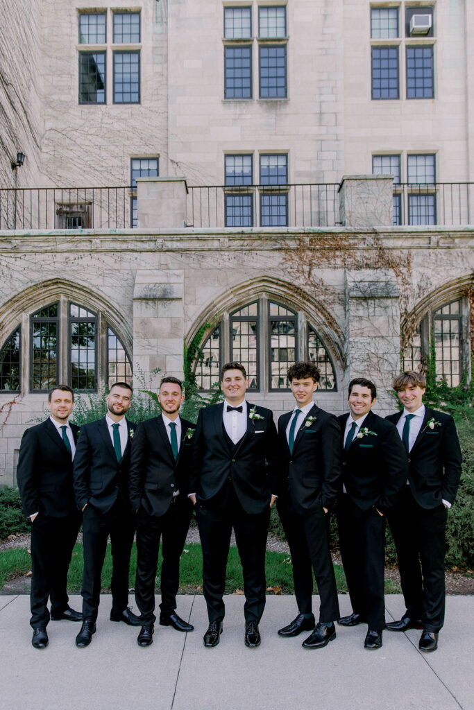 Dominical University bridal party portrait. Emerald green and gold, groomsman