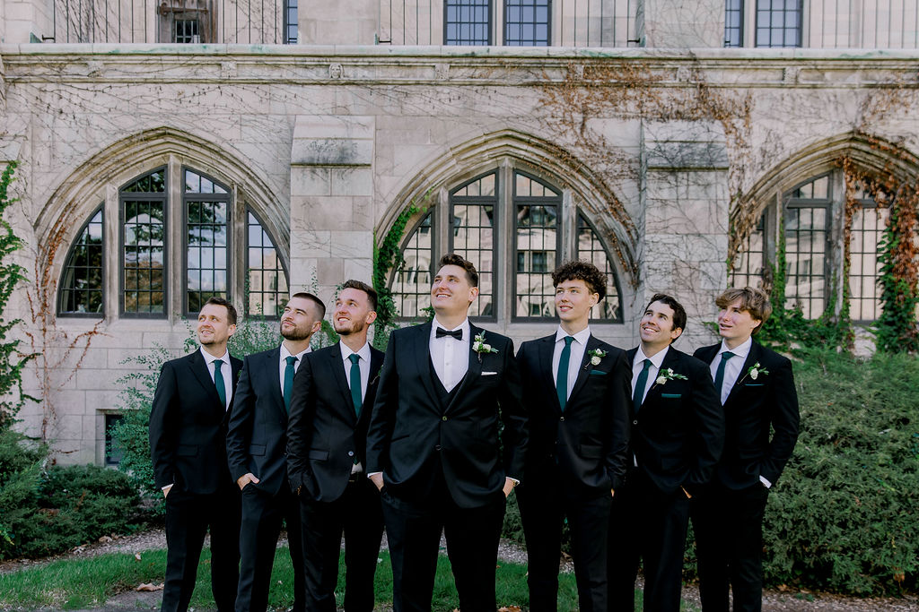 Dominical University bridal party portrait. Emerald green and gold, groom with groomsman
