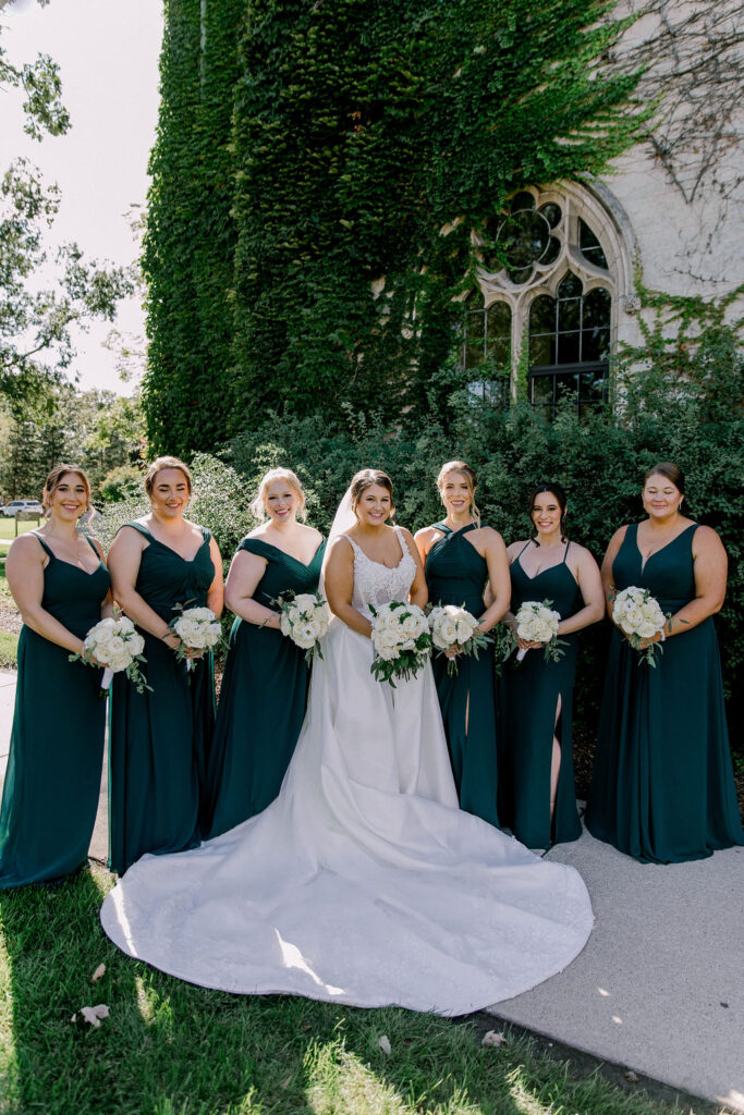 Dominical University bridal party portrait. Emerald green and gold, bridesmaids
