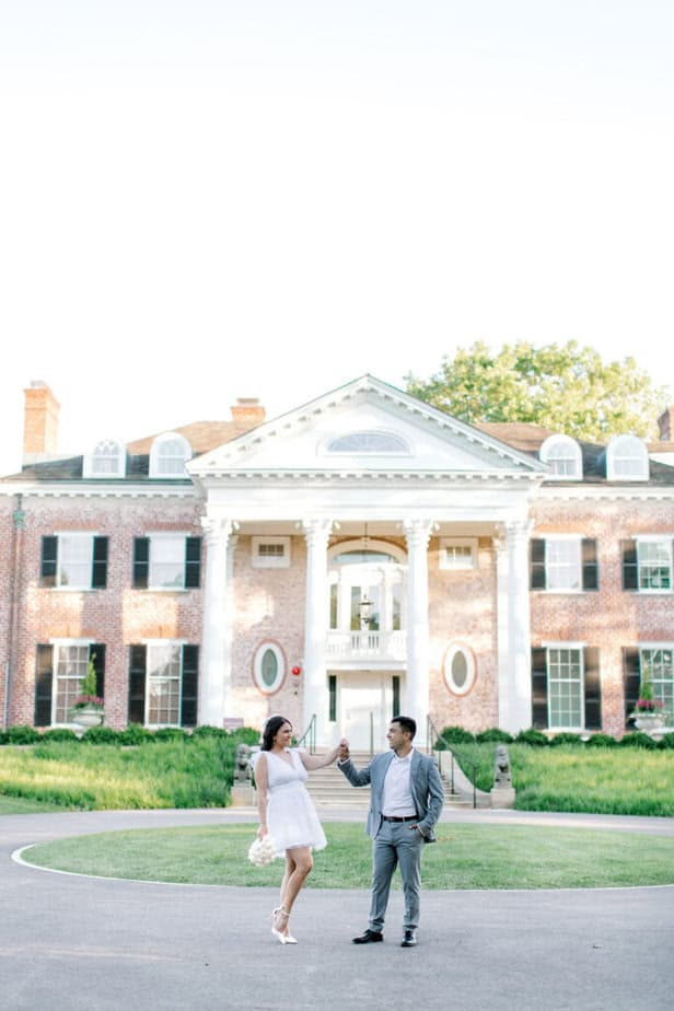 Playful moment of the couple dancing near Cantigny Park’s historic mansion.