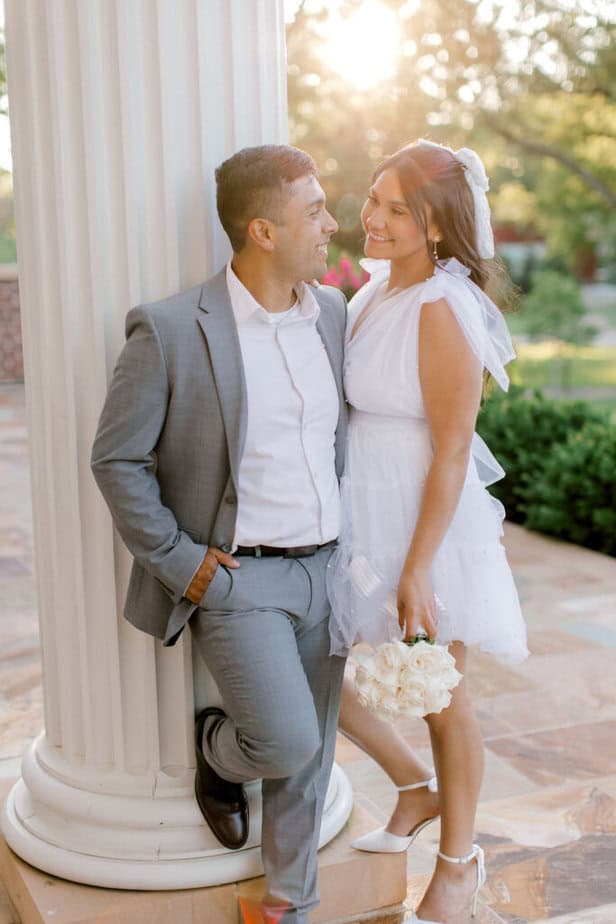 couple kissing in front of a glowing sunset at Cantigny Park.