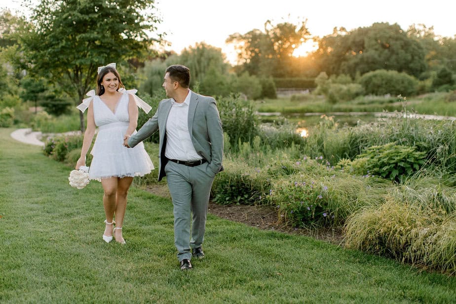 engaged couple walking in Cantigny Park 