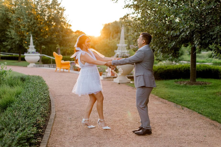 Pathway lined with colorful flowers at Cantigny Park, perfect for a Chicago wedding photographer's engagement session.